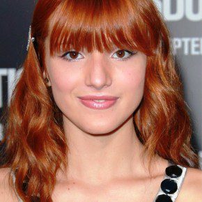 Long Red Wavy Hairstyle With Bangs