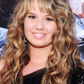 Long Tousled Curly Hairstyle With Bangs