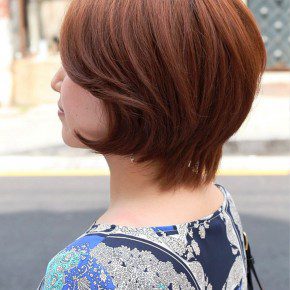 Side View Of Short Auburn Haircut For Women